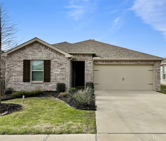 view of front of house featuring a garage and a front lawn