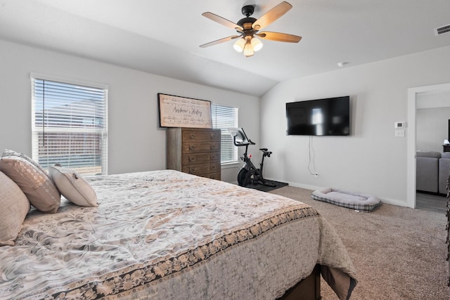 carpeted bedroom featuring ceiling fan and vaulted ceiling