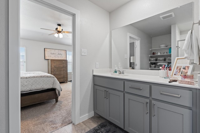 bathroom with ceiling fan and vanity