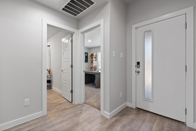 foyer entrance featuring light wood-type flooring