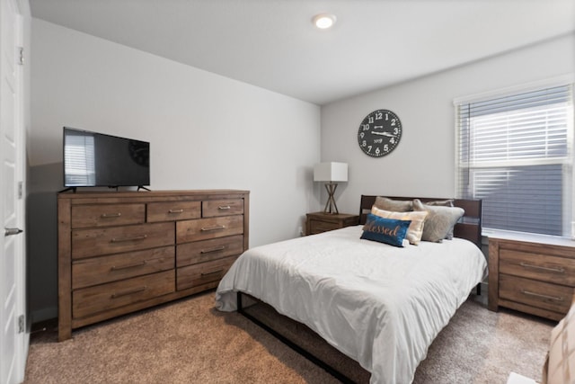 bedroom featuring light colored carpet