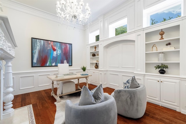 office with dark wood-type flooring, an inviting chandelier, and built in features