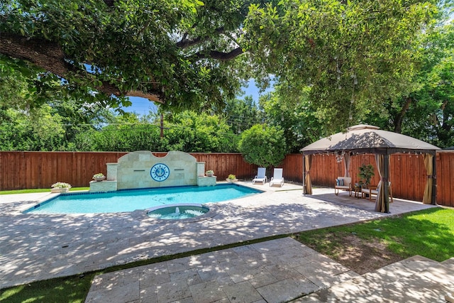 view of swimming pool featuring a patio, an in ground hot tub, and a gazebo