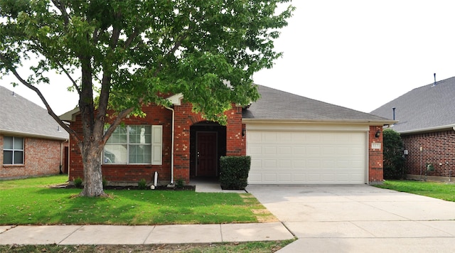 single story home featuring a front lawn and a garage