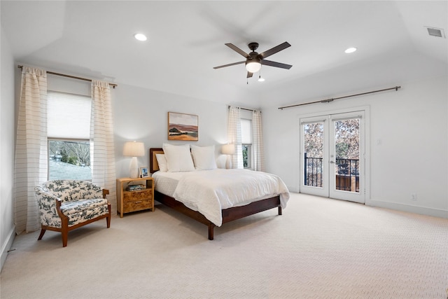 bedroom with light carpet, multiple windows, access to exterior, and ceiling fan