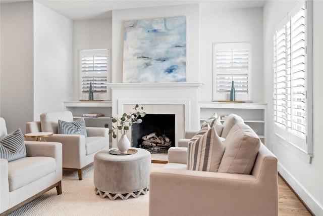 living room with a wealth of natural light and hardwood / wood-style flooring