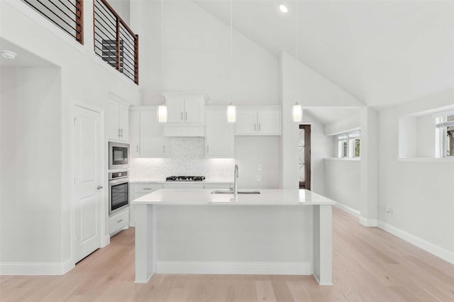 3420 Running Stream Way, Melissa, TX 75454 - kitchen featuring a sink, appliances with stainless steel finishes, light wood-style flooring, high vaulted ceiling, and white cabinets