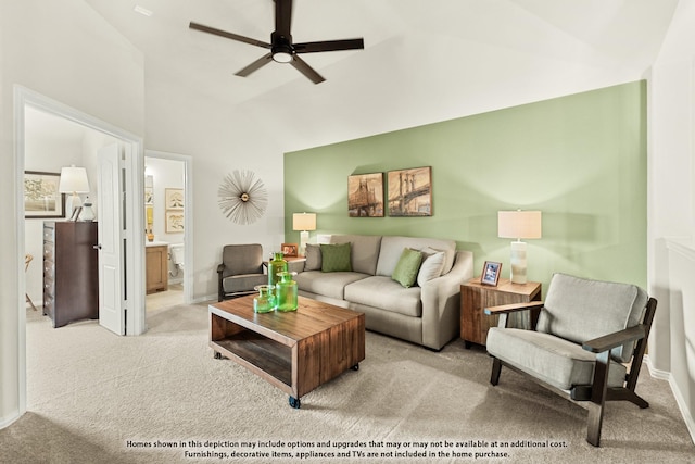 living room featuring high vaulted ceiling, ceiling fan, and light colored carpet