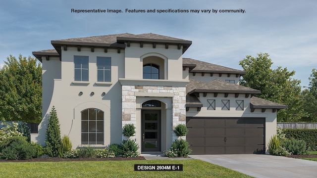 view of front of house with a front yard and a garage