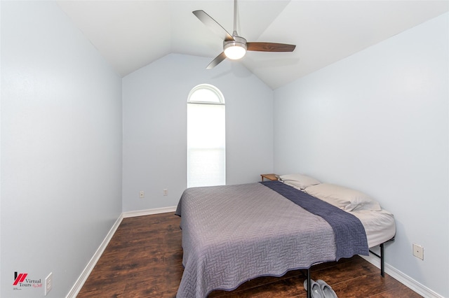 bedroom with ceiling fan, baseboards, lofted ceiling, and wood finished floors