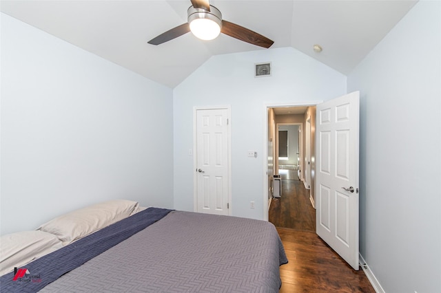 bedroom with visible vents, a ceiling fan, lofted ceiling, and dark wood-style flooring