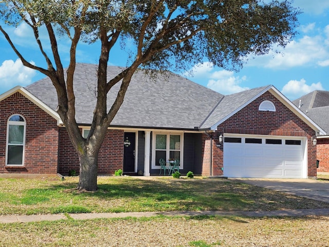 view of front facade featuring a garage, brick siding, concrete driveway, and a shingled roof