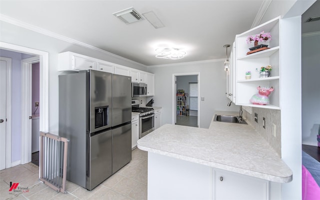 kitchen featuring appliances with stainless steel finishes, kitchen peninsula, ornamental molding, sink, and white cabinetry