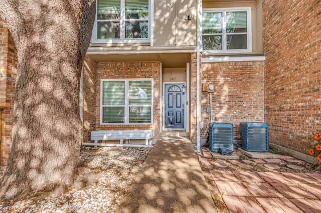 view of exterior entry featuring central AC