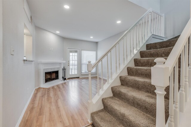 unfurnished living room with light hardwood / wood-style floors and a fireplace