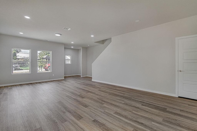 empty room with hardwood / wood-style flooring