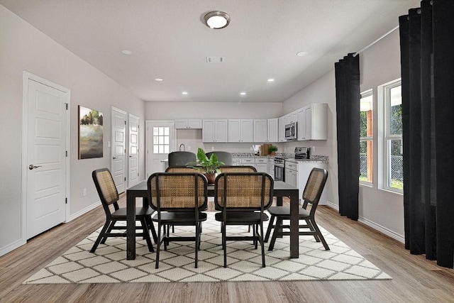 dining room featuring light hardwood / wood-style flooring