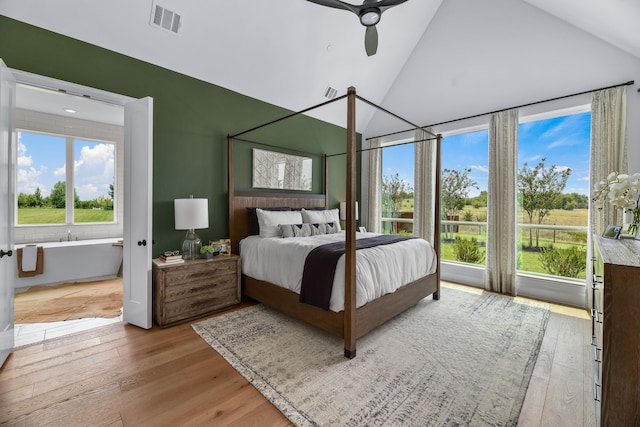 bedroom with lofted ceiling, light wood-type flooring, and ceiling fan