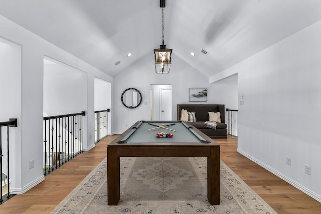 game room with vaulted ceiling, billiards, and light hardwood / wood-style floors