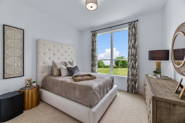 bedroom featuring light carpet