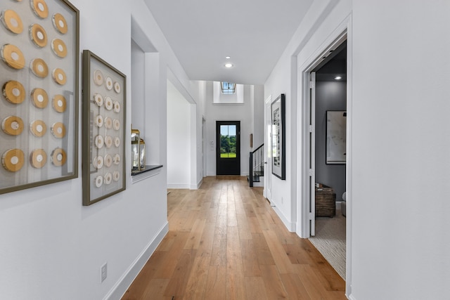 hall with light wood-type flooring