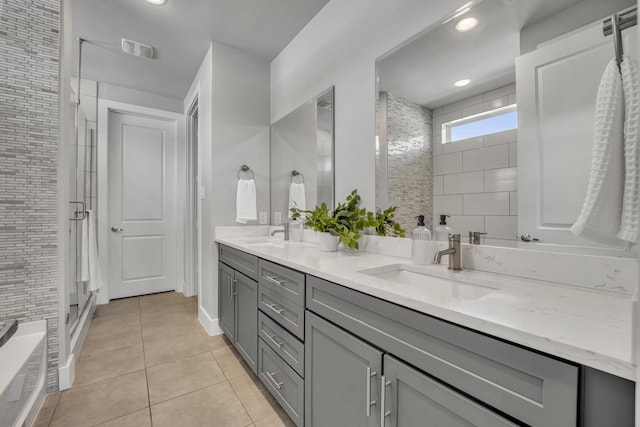 bathroom featuring plus walk in shower, tile patterned floors, and vanity