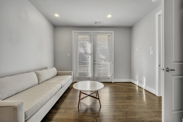 living room with dark hardwood / wood-style flooring