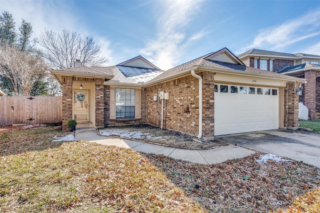 ranch-style home featuring a garage