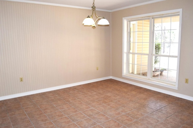 tiled spare room with an inviting chandelier and crown molding