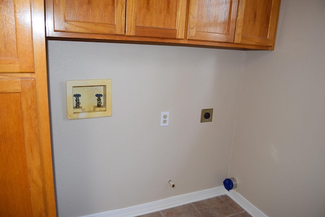 laundry room with hookup for a washing machine, cabinets, hookup for an electric dryer, tile patterned flooring, and gas dryer hookup