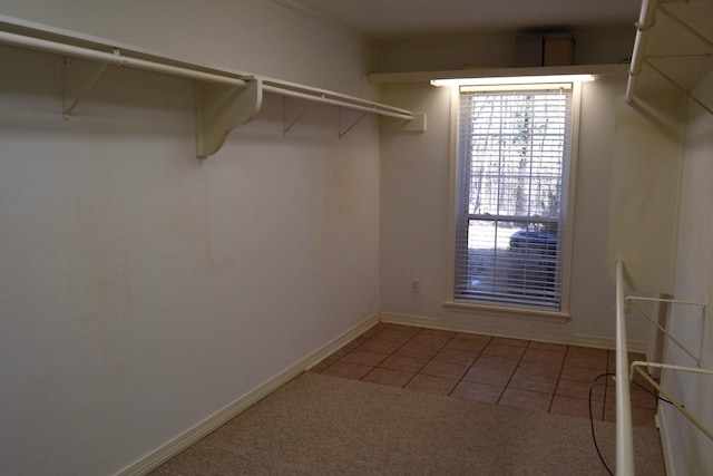 spacious closet with light tile patterned floors