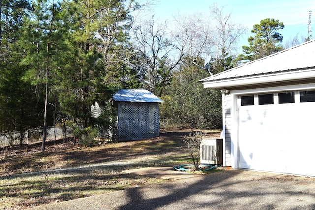 garage featuring central AC unit