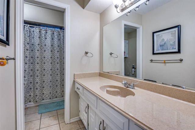 bathroom featuring tile patterned floors and vanity