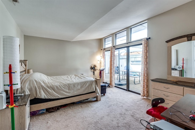 bedroom featuring access to exterior and light carpet