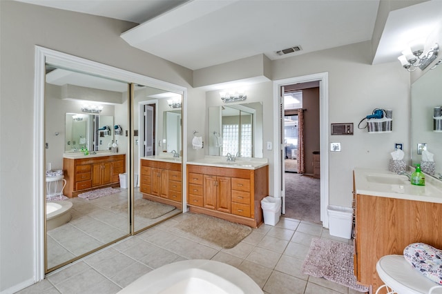 bathroom with vanity and tile patterned flooring