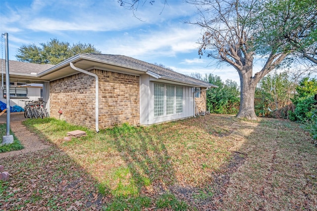 view of property exterior with a lawn