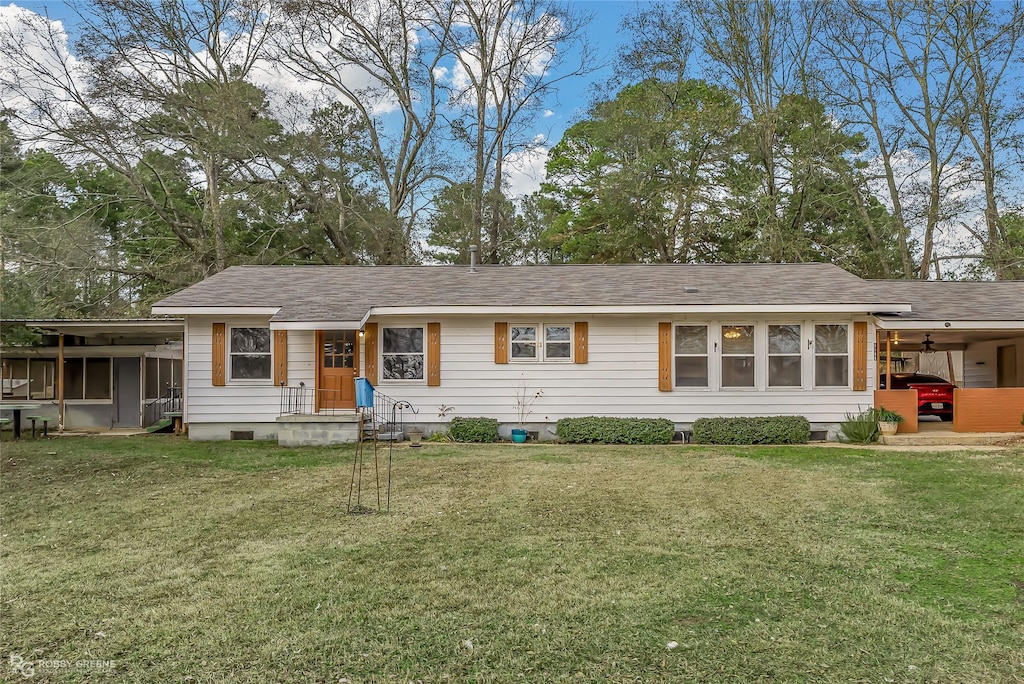 ranch-style home with a front lawn