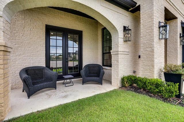 property entrance featuring french doors