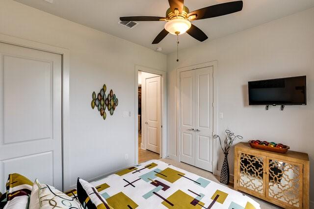 bedroom with a closet and ceiling fan