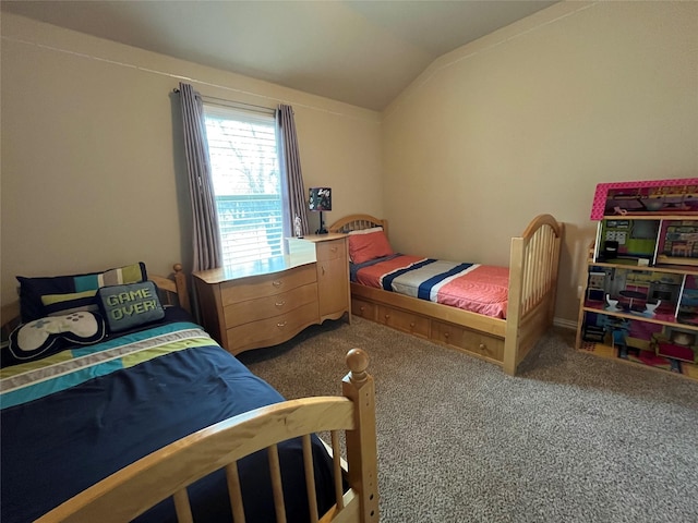 bedroom featuring carpet and lofted ceiling