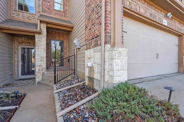 view of exterior entry featuring a garage