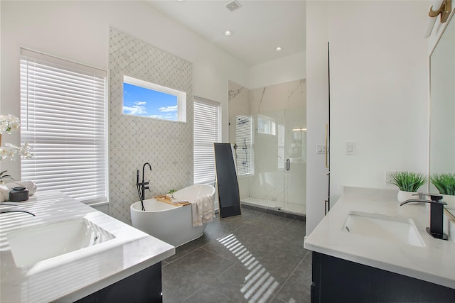 bathroom with vanity, tile patterned floors, and separate shower and tub