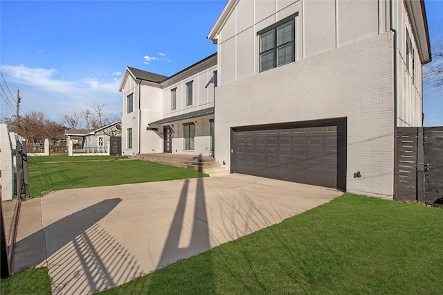 view of front of house featuring a front yard and a garage