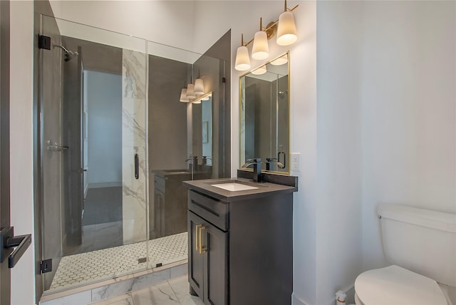 bathroom featuring toilet, an enclosed shower, and vanity