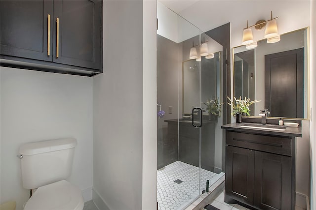 bathroom with toilet, tile patterned flooring, a shower with door, and vanity