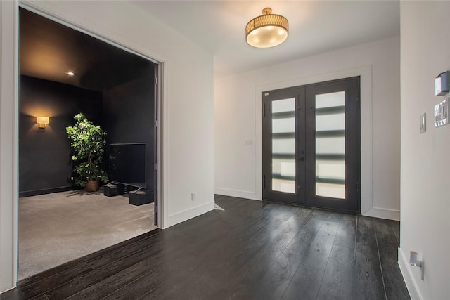 entrance foyer with french doors and dark hardwood / wood-style floors