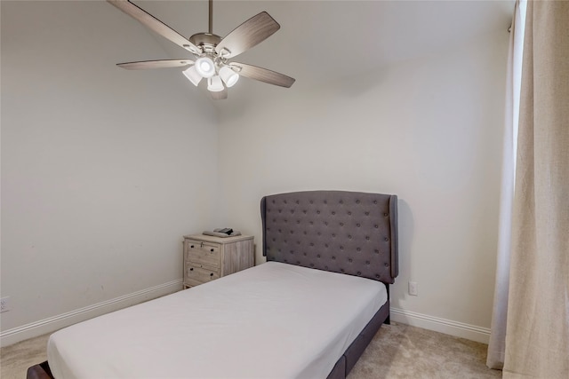 bedroom with light colored carpet and ceiling fan