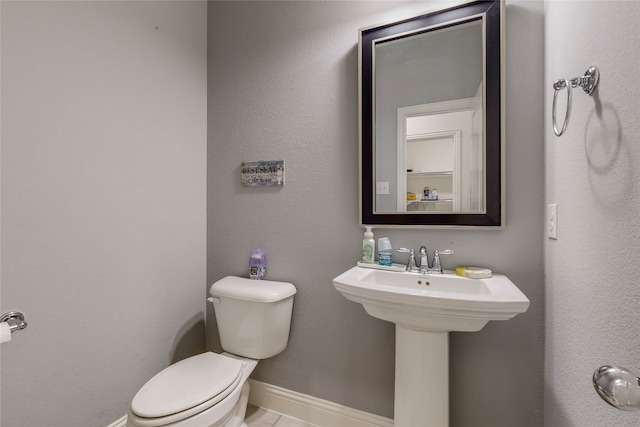 bathroom with toilet and sink