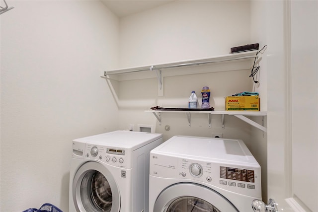 laundry area with washing machine and clothes dryer