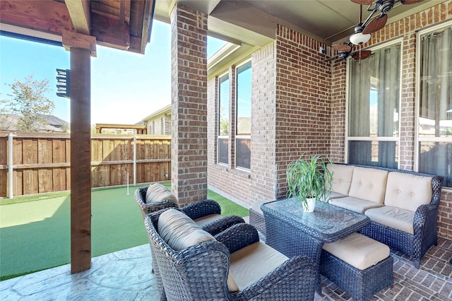 view of patio featuring an outdoor hangout area and ceiling fan